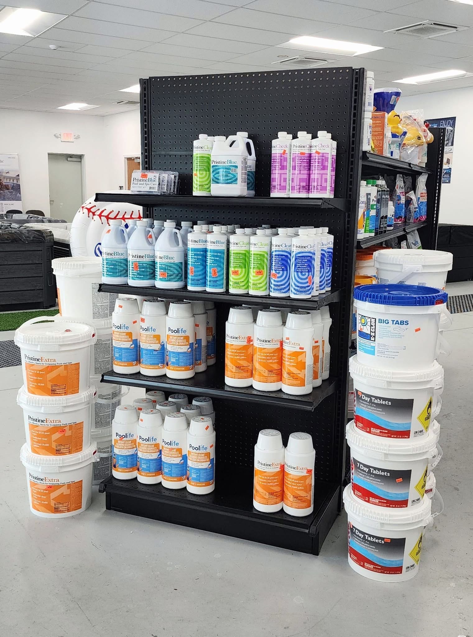 A shelf full of Pristine Blue pool and spa treatment products